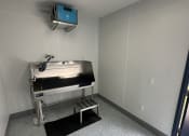 Thumbnail 16 of 31 - a patient room with a sink and a mirror
